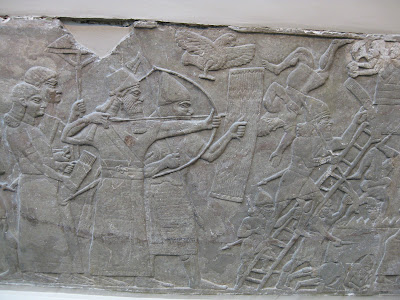 Assyrian siege - wall relief from palace of Ashurnasirpal II at Nimrud Assyrian siege - wall relief from palace of Ashurnasirpal II at Nimrud